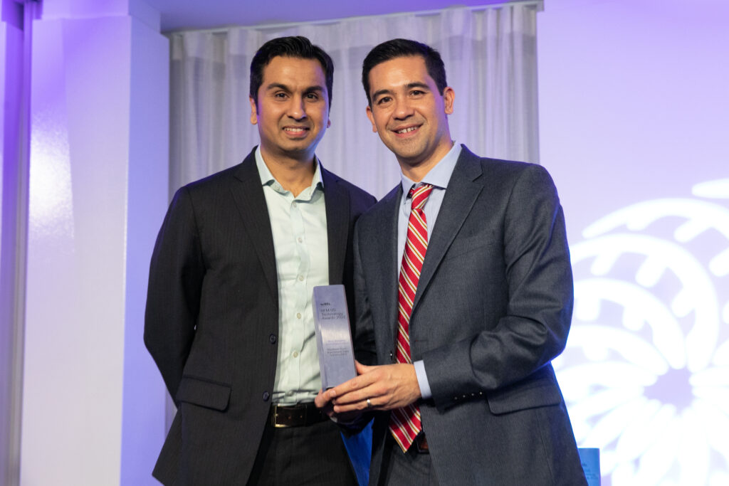 HFM Award 2022 acceptance photo with Sandeep Varma, EDS CEO, and Tom Zita, Northern Trust IDS.